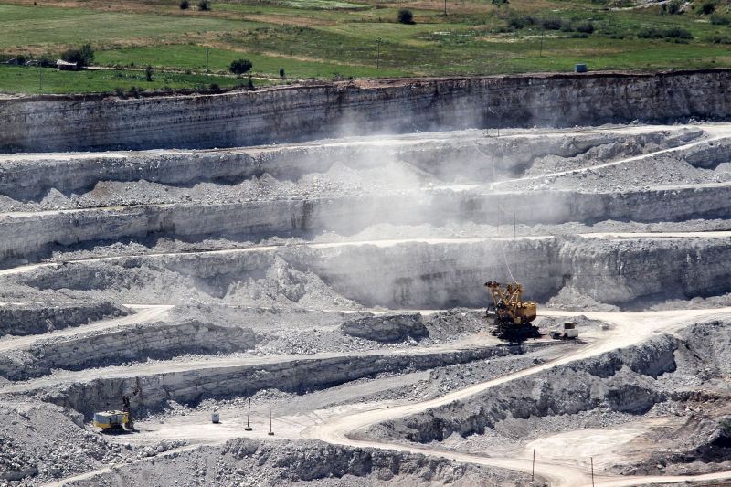 What role does the air compressor play in the mining process?